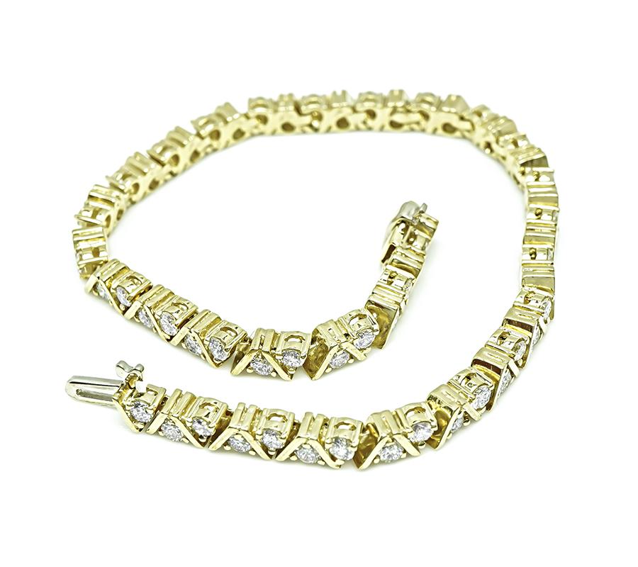 Estate yellow gold bracelet featuring 3.40ct round diamonds