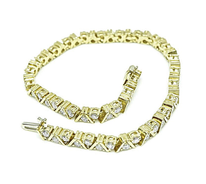 Estate yellow gold bracelet featuring 3.40ct round diamonds