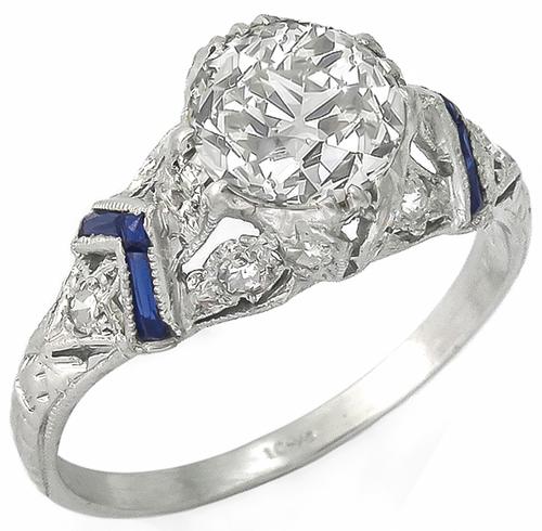 Vintage 1.06ct Round Brilliant Cut Diamond 0.30ct Diamond Sapphire Platinum Diamond Engagement Ring